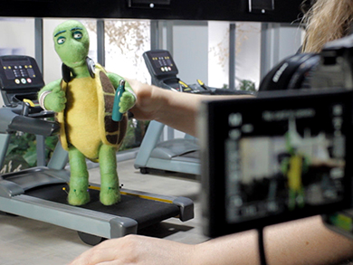 Emma Windsor animating stop motion puppet on set